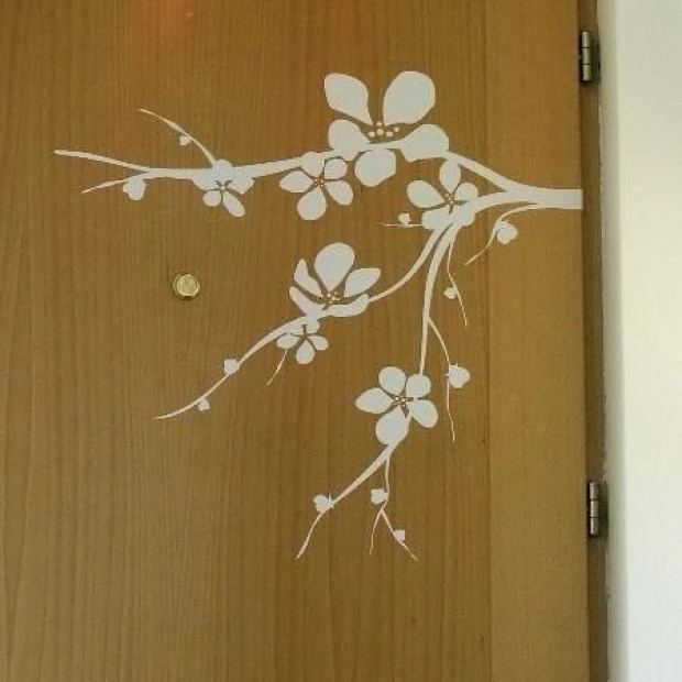 Elegant branch with delicate white flowers, perfect for a minimalist interior.