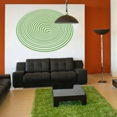 Abstract painting template 1068 - Living room arrangement with orange walls, dark furniture, and light flooring.