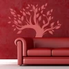 Elegant pink tree that beautifully complements the red backdrop of a modern living room.