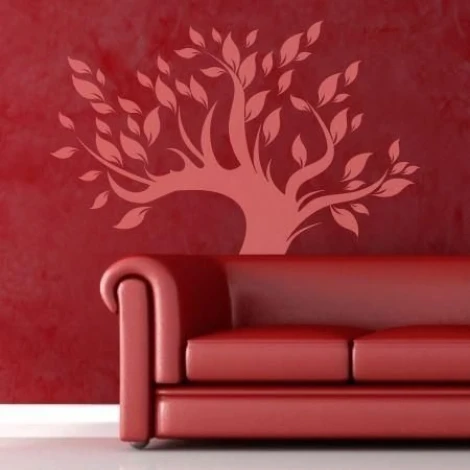 Elegant pink tree that beautifully complements the red backdrop of a modern living room.