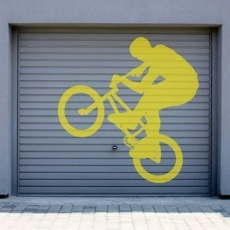 Dynamic cyclist silhouette in vibrant yellow, perfect for a modern garage or youth space.