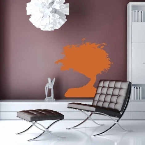 Stylish bonsai tree in vibrant orange, perfect for a modern living room, adds a touch of elegance.