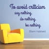 Painting template 02X 13 quote: to avoid criticism 1748 - Living room setup. Light-colored wall, yellow chair in the corner.