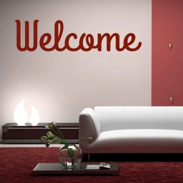 Sticker 03X 06 welcome 1700 - Living room setup with pink walls, white sofa, and dark rug.