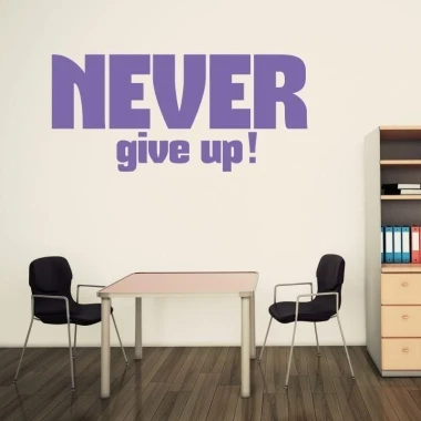 Sticker 03X 24 never give up 1716 - Office setup with light walls, wooden floor, and simple furniture.