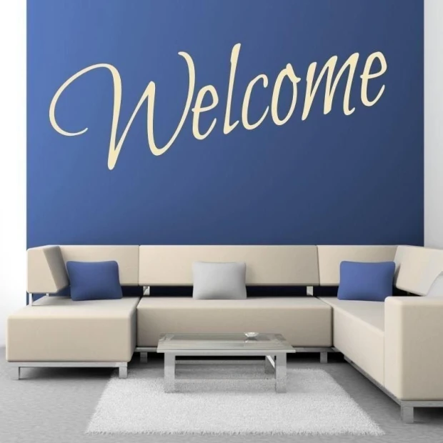 Sticker 03X 25 welcome 1701 - Living room setup with dark wall, light sofa, and pillows in shades.