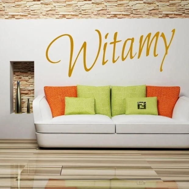 Sticker 03X 25 welcome 1704 - Living room setup. Light-colored wall with stone pattern, sofa with green pillows.