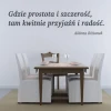 Sticker 03X 06 quote: where simplicity and honesty meet 1766 - Dining room decor. Light walls, wooden table, and white chairs.