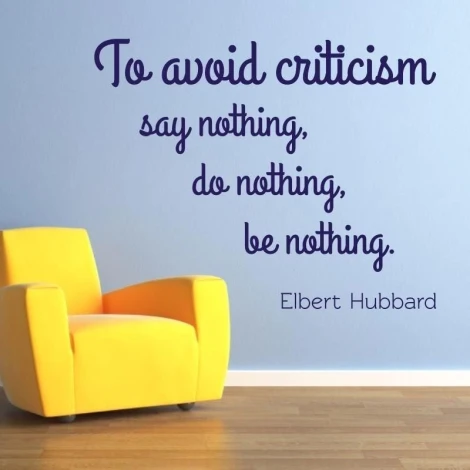 Sticker 03X 20 quote: to avoid criticism 1748 - Room arrangement. Light-colored wall, yellow armchair in the corner.