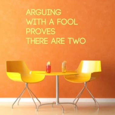 Sticker 03X 21 arguing with fool 1758 - Dining room setup. Orange wall, metal table, two yellow chairs.