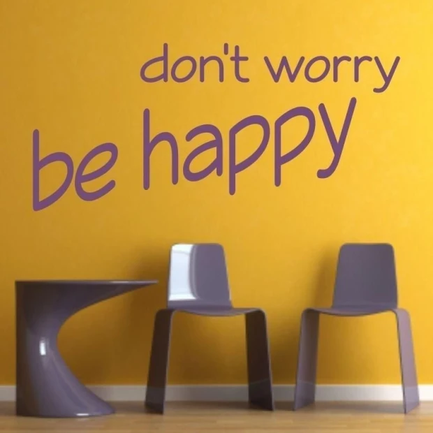 Sticker 03X 24 don\'t worry be happy 1735 - Room setup with yellow wall and purple furniture.