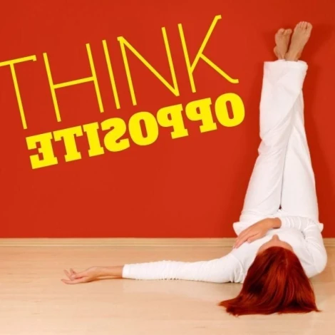 Sticker 03X 24 think opposite 1724 - Graphic design. Yellow text THINK OPPOSITE on red background, figure lying on the floor.