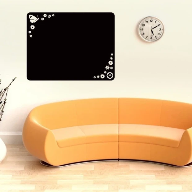 Chalk sticker 009 butterfly flowers - Room decor with light walls and an orange sofa.