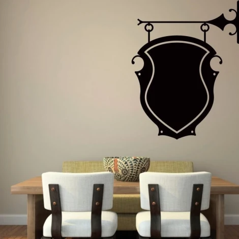 Chalk sticker ornament 030 - Dining room setup with light walls, wooden table, and chairs with light upholstery.
