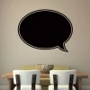Chalk sticker 037 speech bubble - Dining room setup with light walls and a table with neutral-colored chairs.