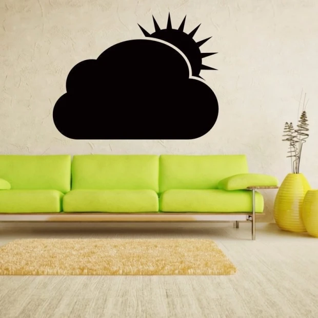 Chalk sticker 044 sun cloud - Living room setup with light walls, green sofa, and rug.