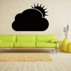 Chalk sticker 044 sun cloud - Living room setup with light walls, green sofa, and rug.