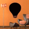 Chalk sticker 060 light bulb - Modern living room decor with orange walls and gray furniture.