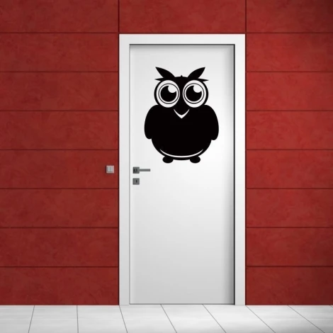 Charming chalkboard owl sticker on a door in a modern interior, perfect for a child\'s room or nursery.