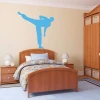 Sticker 03X 18 karate 1853 - Bedroom decor with light walls, wooden furniture, and a checkered bedding set.