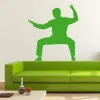 Sticker 03X 04 karate 1867 - Living room setup with light-colored walls and modern green furniture.
