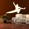 Sticker 03X 21 karate 1859 - Living room setup. Dark brown wall, light furniture, potted plant.