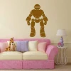 Sticker 03X 15 robot 1852 - Living room setup with light-colored walls and a pink sofa with cushions.