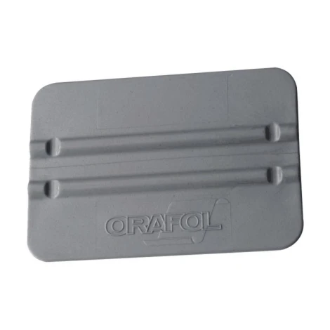 Plastic scraper for applying templates and stickers - Graphic design. Rectangle with two grooves along the sides.