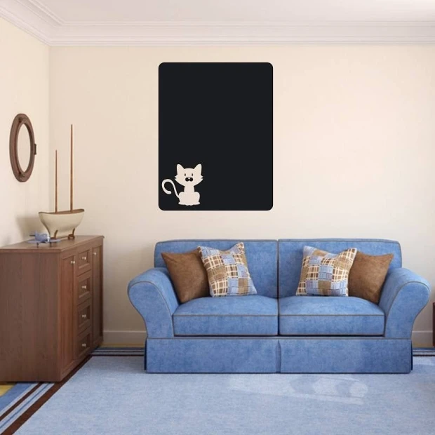 Chalkboard cat sticker 109 - Living room setup with light walls and a blue couch with checkered pillows.