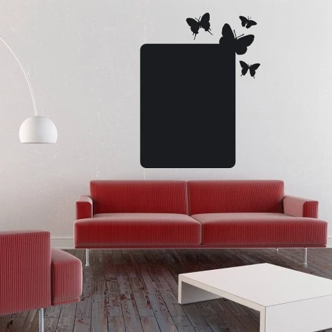Chalk sticker butterflies 094 - Living room setup with light walls, red corner sofa, and white table.
