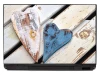 Heart laptop sticker P223 - Graphic design featuring two hearts in different colors on a light wood background.