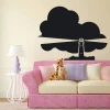Chalkboard lighthouse sticker 113 - Living room decor with light-colored walls and pastel furniture.