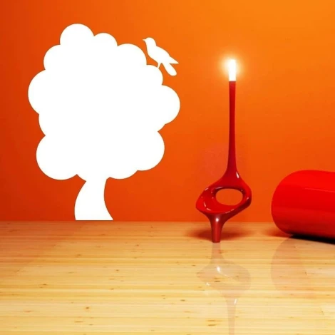 Dry-erase board wood 122 - Styled in a modern interior with a vibrant orange wall.