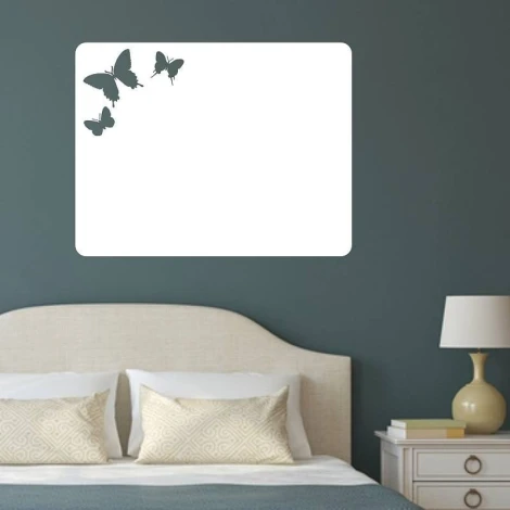Dry-erase board butterflies 095 - Bedroom setup with dark walls and a bed featuring a light headboard.