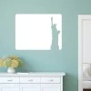 Dry-erase board with Statue of Liberty design in a blue room with light furniture.