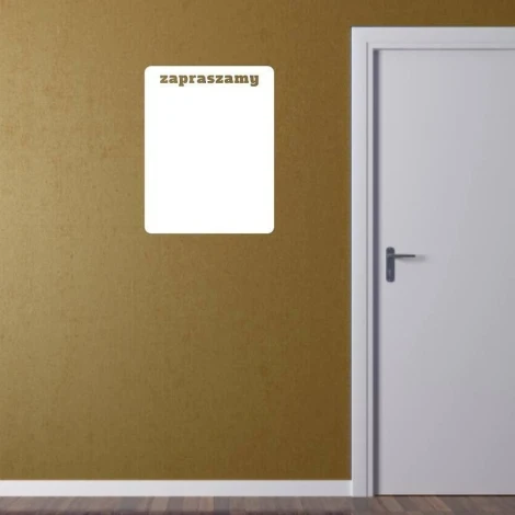Dry-erase board in a room with a brown wall. The board has a rectangular shape.
