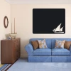 Chalk sticker yacht 134 - Living room decor with light walls, blue sofa, and wooden furniture.