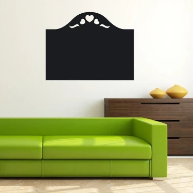 Chalk sticker hearts 126 - Living room setup with light walls, green sofa, and dark furniture.
