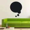 Chalkboard sticker speech bubble 164 - Living room decor. Light-colored wall, modern green sofa.