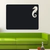 Chalk sticker seahorse 156 - Living room decor with light walls and a green sofa.