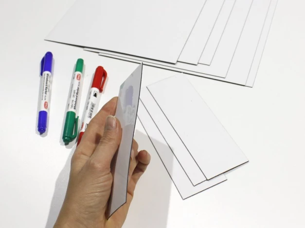 Custom dry-erase magnet - Graphic design. Simple rectangles in various sizes and marker colors.