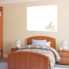 Yacht 134 dry-erase board - Bedroom setup with light-colored walls, wooden furniture, and a patterned bed.