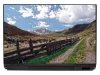Mountain path laptop sticker P382 - Graphic design featuring a mountain trail with a wooden fence and green grass.