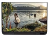 Laptop sticker featuring swans on a lake, set in a natural environment with water, grass, and mountains in the background.