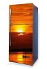 Sunset fridge wrap sticker P65 - Graphic design featuring a sunset over water with a boat.