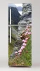 Fridge wrap sticker with floral design featuring pink flowers against a mountain rock backdrop.