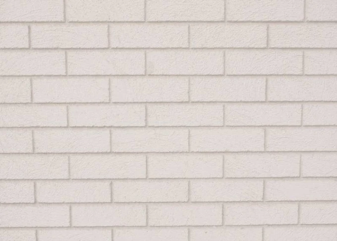 Magnetic whiteboard with a brick design featuring a pattern of white bricks arranged regularly.