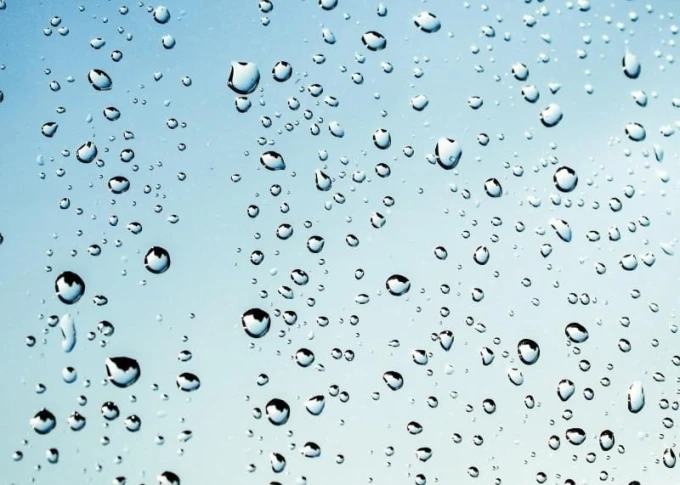 Magnetic dry-erase board with a drop design featuring water droplets on a light background.