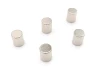 Set of 5 neodymium magnets in various sizes - graphic design. Six cylindrical magnets on a white background.