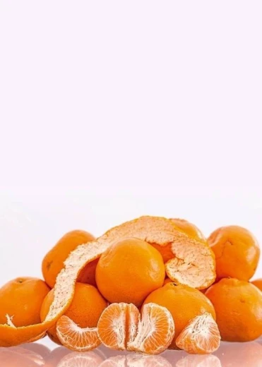 Magnetic dry-erase board with orange design featuring various shapes and fragments of oranges.